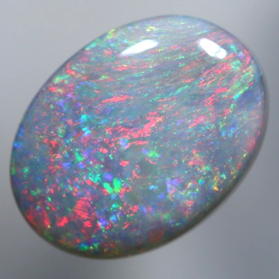 SOLID SEMI BLACK OPAL Sparkles of bright red over green SEE VIDEO